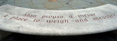 Engraving: "a place to weigh and measure"