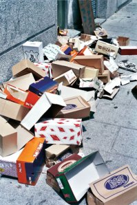 shoe boxes left behind after a street market