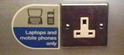 power socket in train: "laptops and mobile phones only"