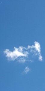 wispy cloud in blue sky