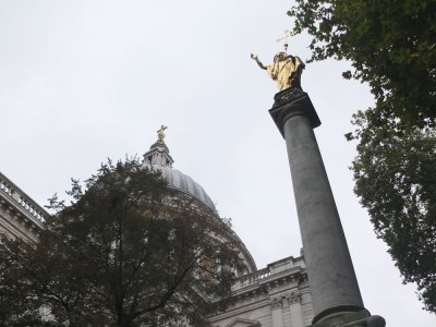 Dome of St Paul's, London and golden statue of St Paul