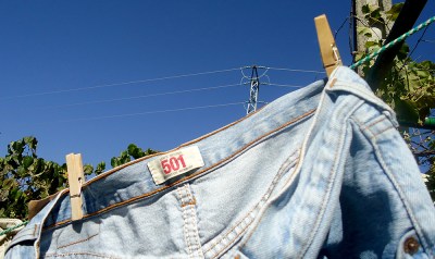 Levis 501s faded jeans hanging on washing line