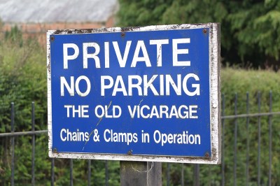No parking sign: Old Vicarage: chains and clamps in operation