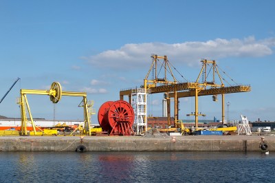 orange, yellow and white machinery & metal structures on Firth of Forth dockside