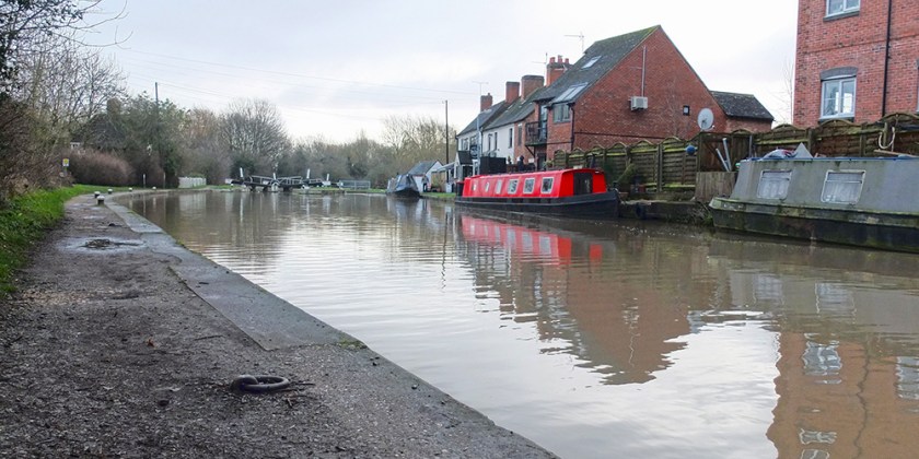 red canal boat moored on Grand Union Canal