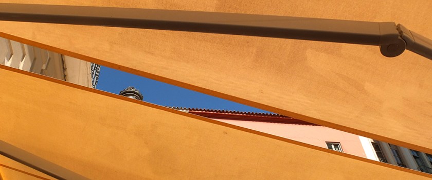 Gap in awning showing blue sky