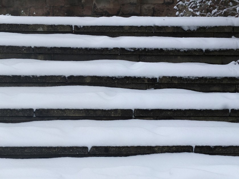 snow settled on outdoor steps