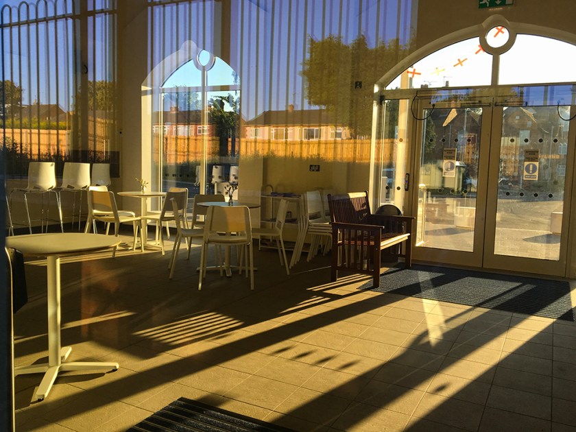 Empty railway indoor café. Bright sunshine