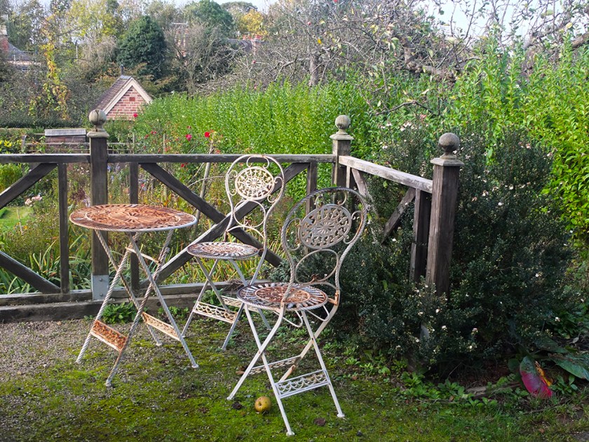 Rusty bistro-style chairs and table