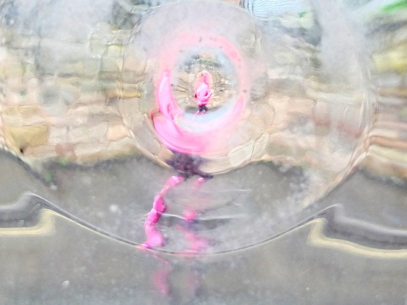 marathon runners seen through distorting window