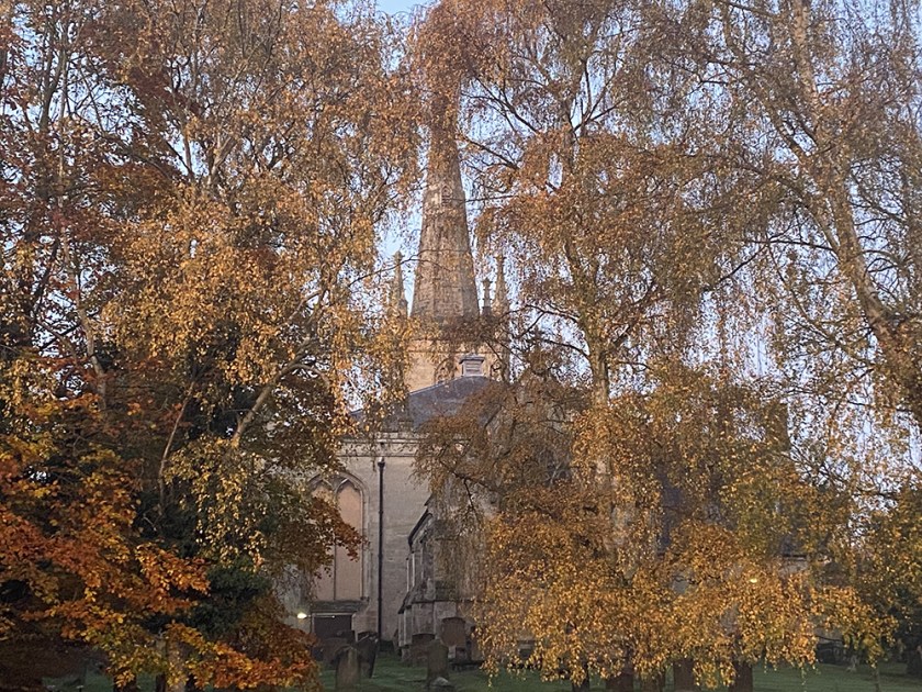 Church steeple and autumnal trees