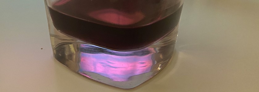 coloured reflection in thick glass